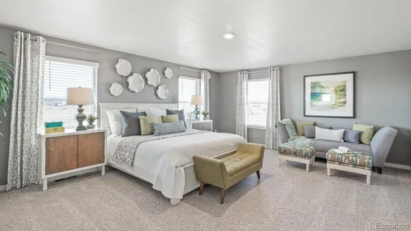 a bedroom with a bed chair and window