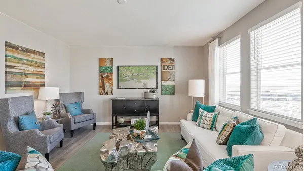 a living room with furniture and a large window