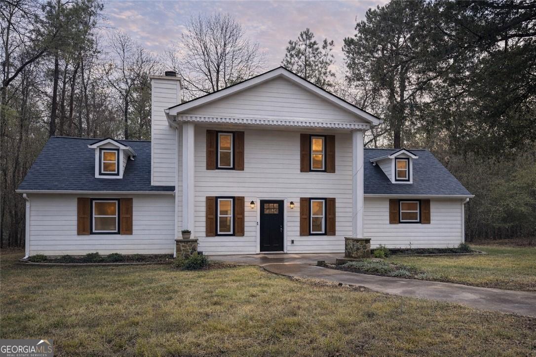 a front view of a house with a yard