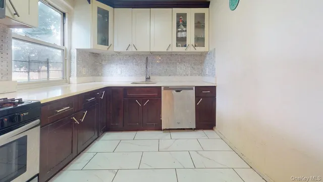 a kitchen with stainless steel appliances granite countertop a sink and cabinets