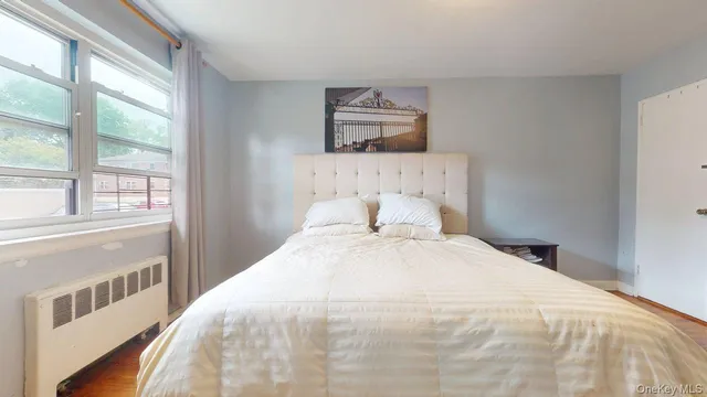 a large white bed in a white room