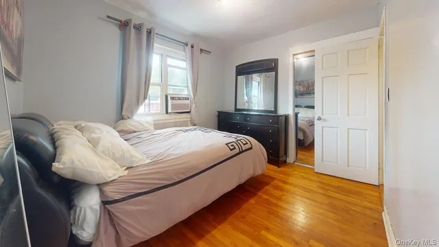 a bedroom with a bed and window