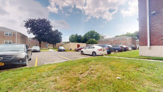 a couple of cars parked in front of a house