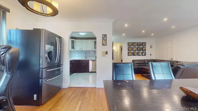 a kitchen with stainless steel appliances granite countertop a refrigerator and a stove