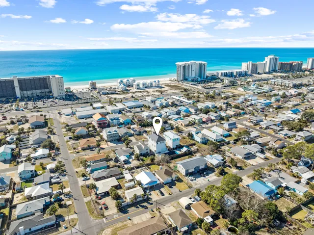 a front view of a house with large windows