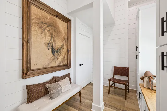 a room with a window and a potted plant