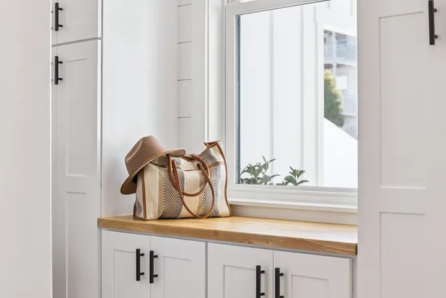 a bed room with a bed window and a chair