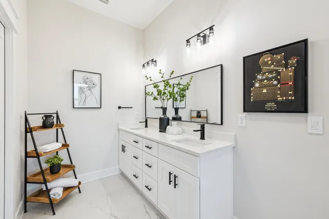 a kitchen with stainless steel appliances granite countertop a sink a stove and refrigerator