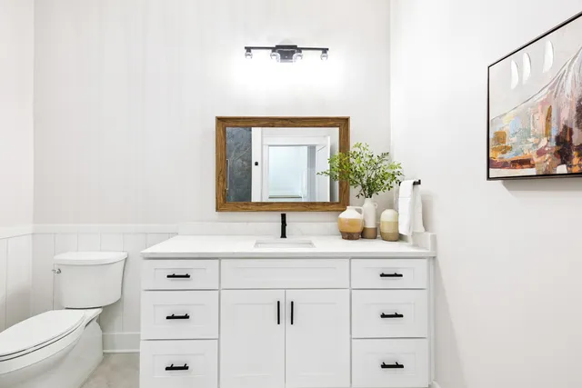 a bedroom with a large bed and a couch