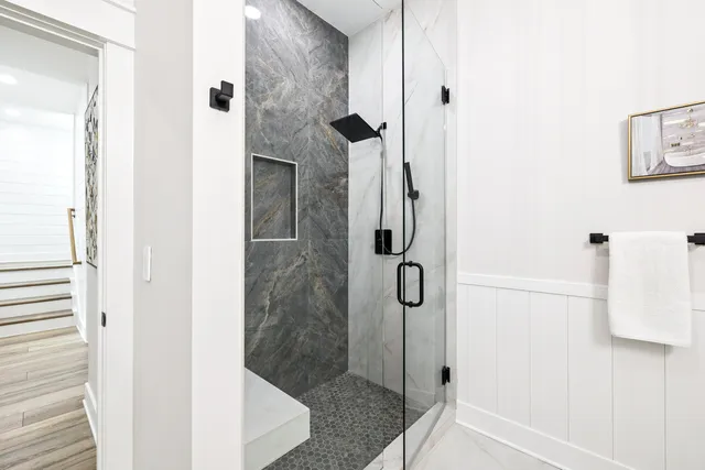 a bedroom with furniture and wooden floor