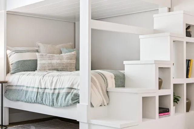 a living room with furniture and wall painting