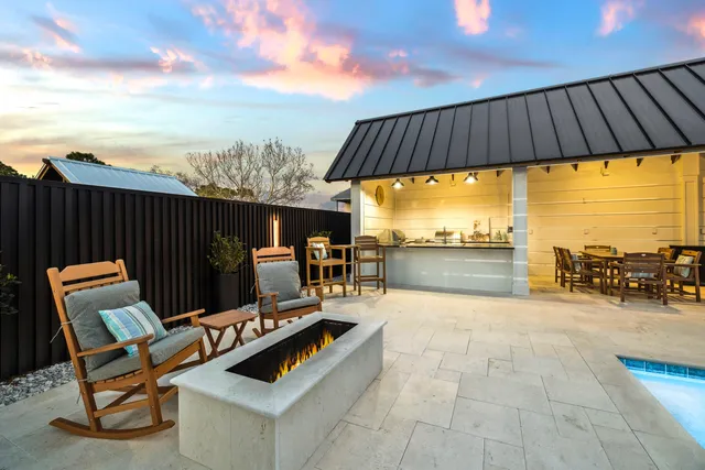 a kitchen with stainless steel appliances granite countertop a sink and stove