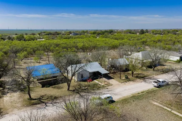 an aerial view of a house with a lake view