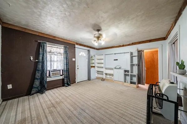 a room with a bed and a window