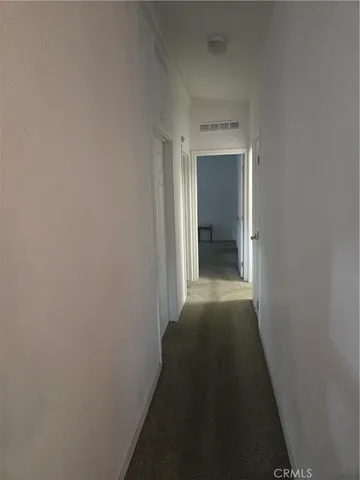 a view of a storage and utility room with cabinets