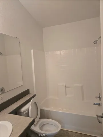 a bathroom with a sink vanity and a mirror