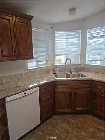 a kitchen with sink and window