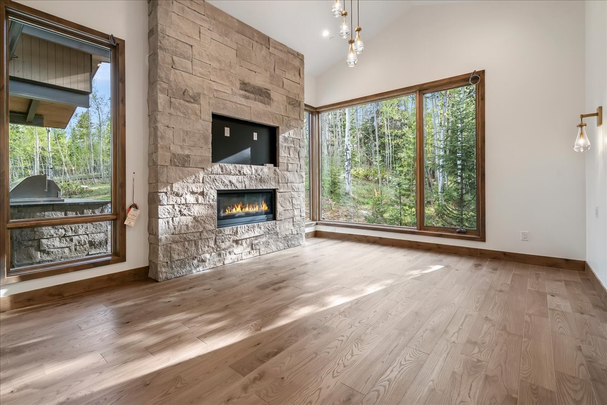 1615 Golden Eagle Road Silverthorne, CO 80498 - Photo 24 of 47 a view of an empty room with window and fire place