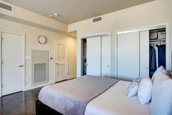 a bedroom with a bed and a table