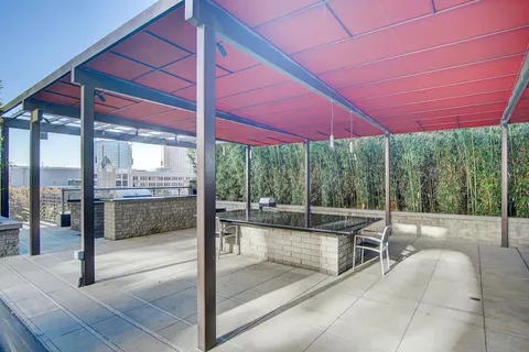 a view of a house with backyard and porch