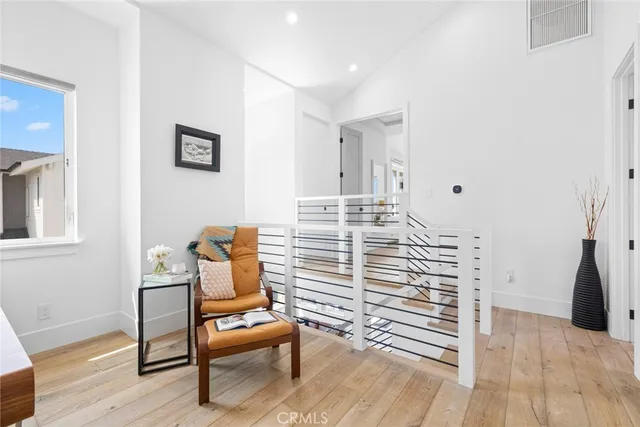 a bedroom with a bed and a chair