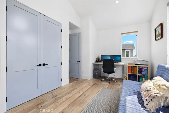 a view of a workspace with furniture and a bedroom