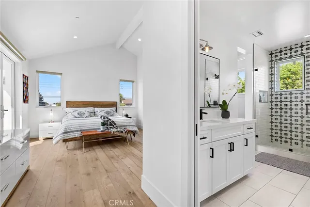 a view of living room kitchen with furniture and wooden floor