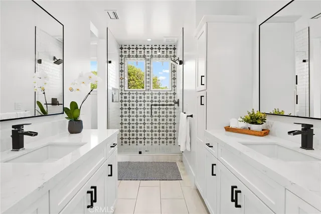 a bathroom with a bathtub sink and mirror