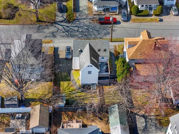 a aerial view of a houses with street
