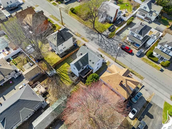 an aerial view of a house with a garden