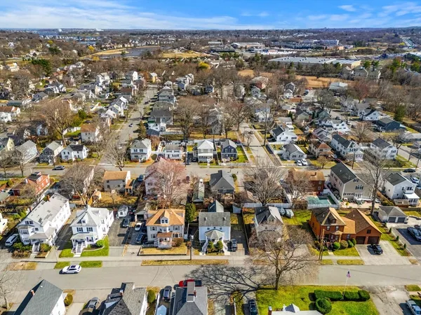an aerial view of residential building with parking