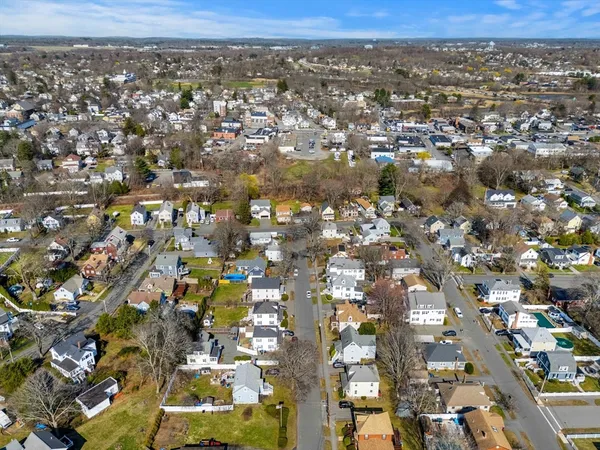 an aerial view of residential houses with outdoor space