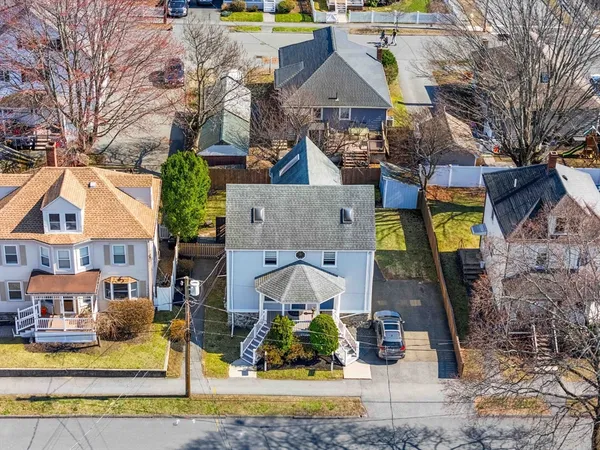 a view of multiple houses with a yard