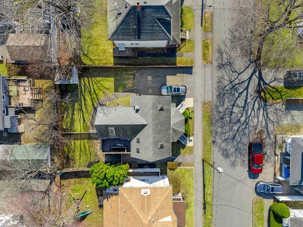 a aerial view of multi story residential apartment building with yard