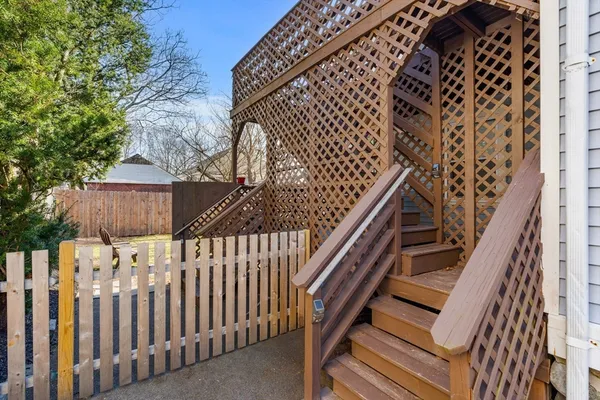 a view of deck with wooden floor and fence