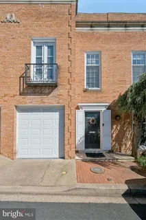 front view of a brick house with a street