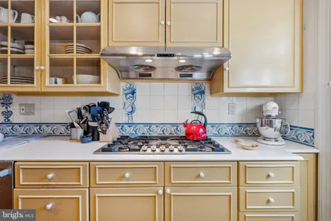 a kitchen with a sink and a stove