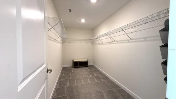 a bedroom with a bed and wall painting