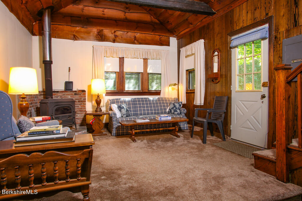 147 Sumner Stetson Road Heath, MA 01339 - Photo 32 of 37 a living room with furniture and a fireplace