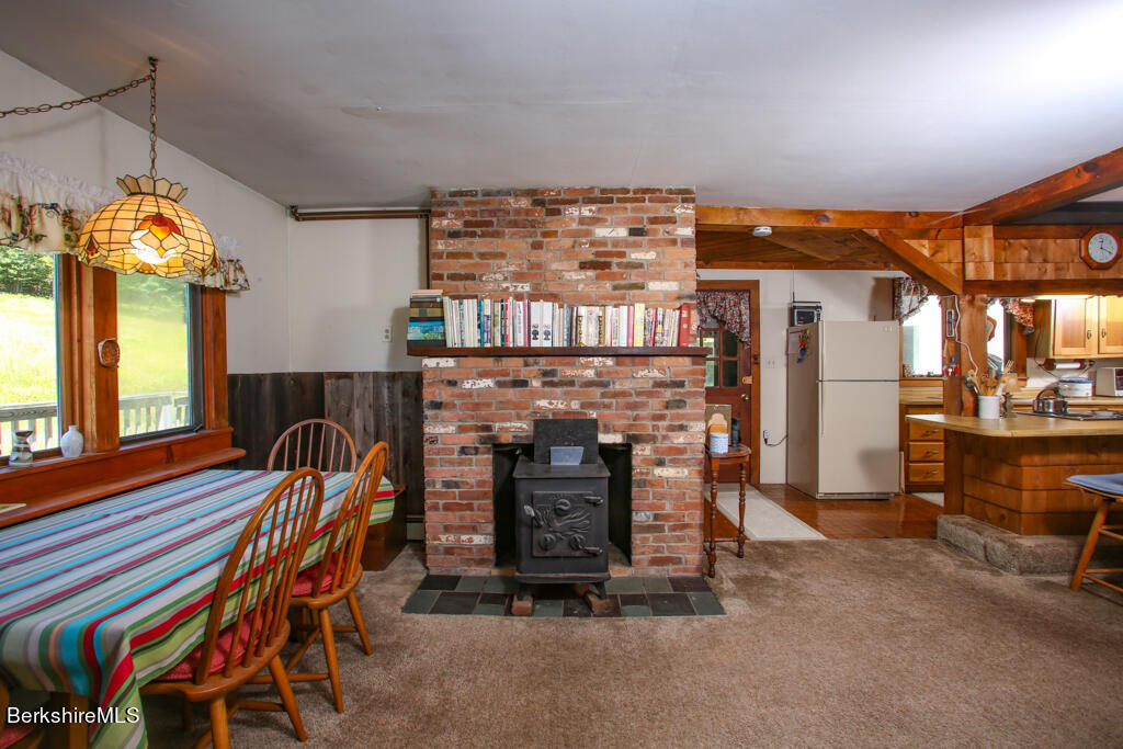 147 Sumner Stetson Road Heath, MA 01339 - Photo 33 of 37 a living room with furniture and a fireplace