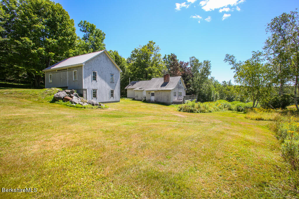147 Sumner Stetson Road Heath, MA 01339 - Photo 35 of 37 a view of a swimming pool with an outdoor space and seating area