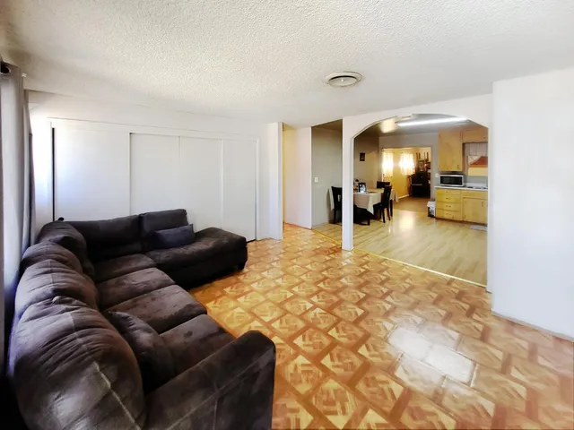 a living room with furniture and a table