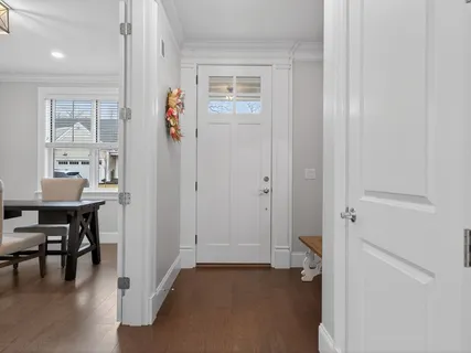 a view of a livingroom with furniture and front door