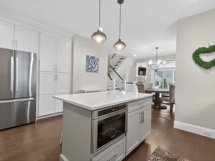 a kitchen with a sink and a refrigerator
