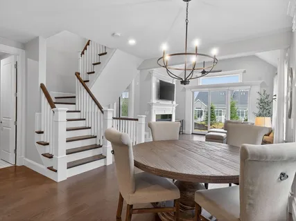a view of a dining room with furniture window and wooden floor