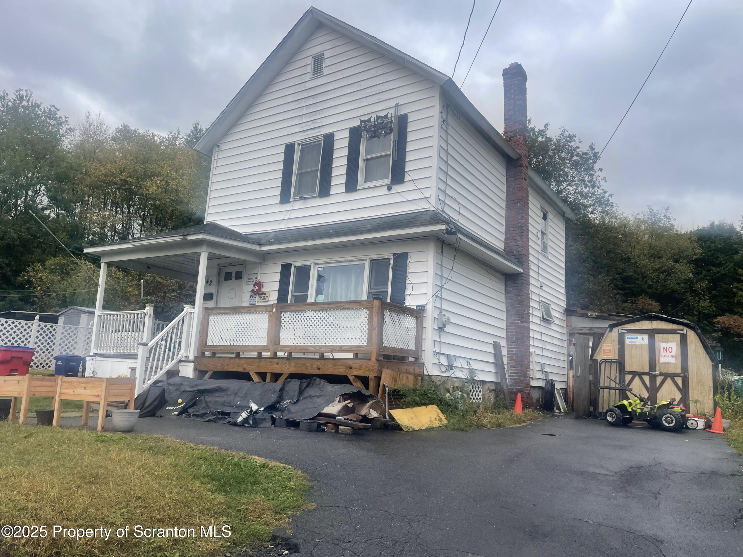 42 Upper Powderly Street Carbondale, PA 18407 - Photo 4 of 7 a view of a house with backyard and porch
