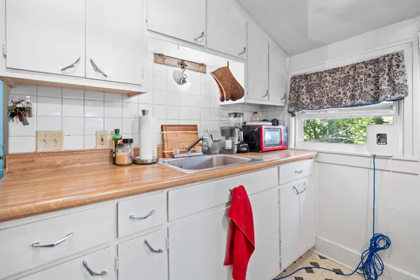 a kitchen with stainless steel appliances granite countertop a sink and cabinets