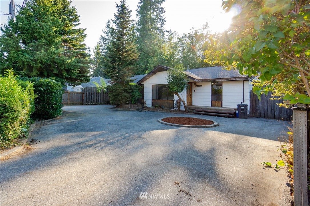 6618 Willow Road Everett, WA 98203 - Photo 2 of 15 a view of a house with backyard and trees