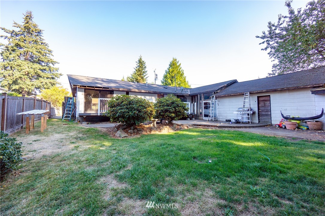 6618 Willow Road Everett, WA 98203 - Photo 14 of 15 a view of a house with a backyard and a patio