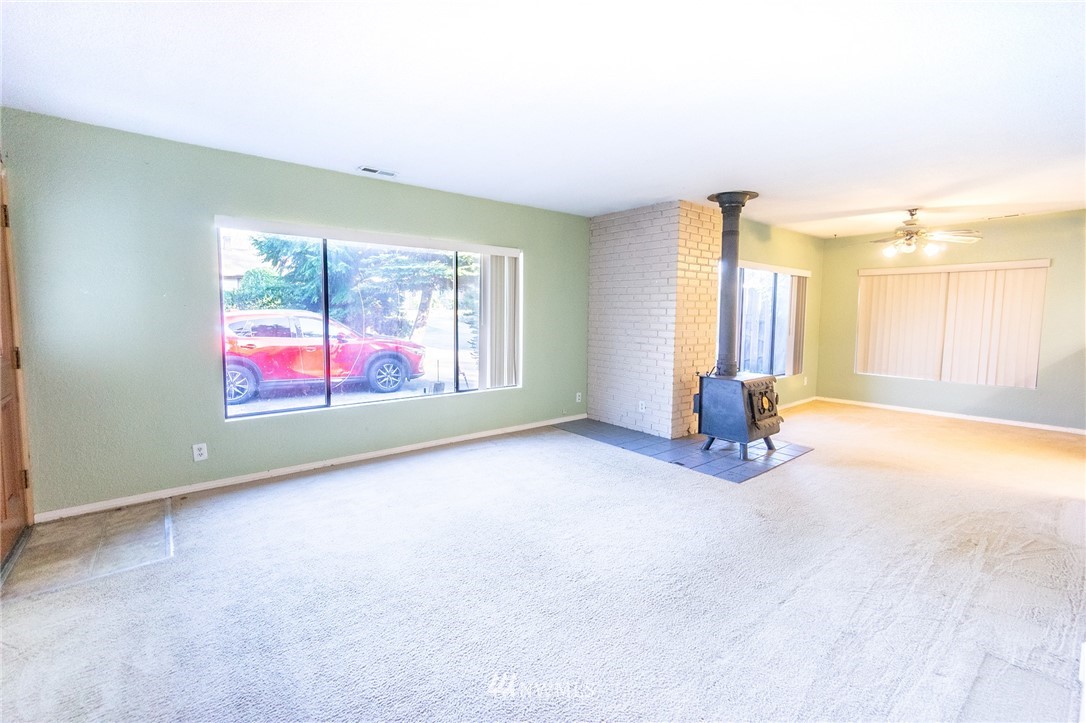 6618 Willow Road Everett, WA 98203 - Photo 5 of 15 an empty room with windows